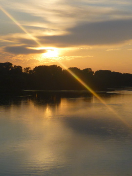 The sun set on the Kaw River just as I was driving over the Lecompton bridge.  I snapped this from the car.